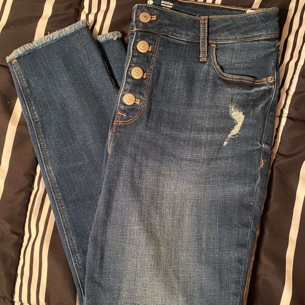 Button front skinny jeans